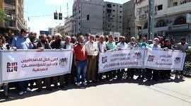Palestinian journalists take part during anti-Israel rally