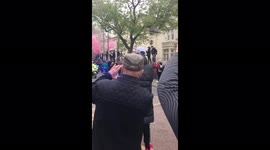 Jurgen Klopp doppelganger welcomes the Liverpool team coach in with Pyro