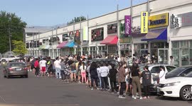 Crowds of people line up wearing face masks give in to temptation during lockdown for South Korean fried chicken in Toronto Canada as new restaurant opens, in a city still in COVID 19 lockdown since October and people are seriously craving so