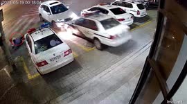 Chinese policeman pushes pedestrians out of way of oncoming car