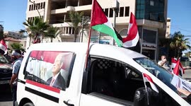Palestinians and Egyptians in Gaza city wave flags after ceasefire