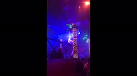 Busy Cancun nightclub with ribbon dancer