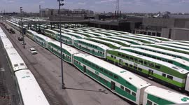 GO transit public transportation commuter trains sit in yard as ridership plummets during COVID 19 pandemic, recession and lockdown in Toronto Canada