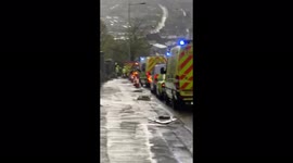 Emergency services attend after alarm raised on building site when worker is trapped in digger