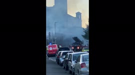 Fire fighters dampen down the fire in Bradford