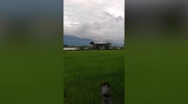 House collapses after swollen river gushes through Philippines village during summer storm
