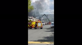 Firefighters continue efforts to fight Fire in a warehouse
