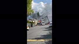 Fire fighters fight fire in old mill complex