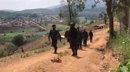 Thai soldiers deliver essential supplies on horseback to remote villages