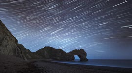 Mesmerising timelapse of night sky over the iconic Durdle Door on UK's Jurassic Coast