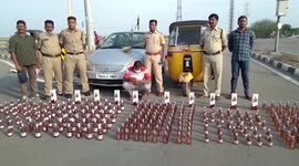 Police officials seize illicit alcohol from smugglers in southern India