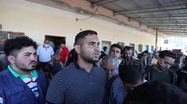 Palestinian fishermen sell fish and seafood for customers at Gaza City's main port