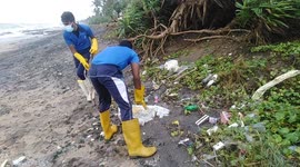 Sri Lankan navy clear debris washed up from cargo ship burning off coast