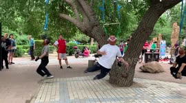 Chinese locals perform bizarre neck exercises by hanging from trees