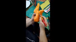 Vietnamese man carves a beautiful rooster from carrots