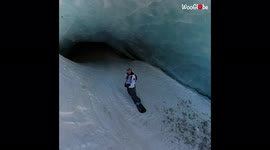 This is what snowboarding inside a Swiss glacier cave looks like