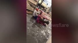 Flash floods submerge road after heavy rain in the Philippines