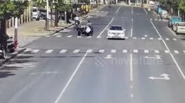 Motorist riding illegally modified vehicle drags Chinese police officer along road to avoid being stopped