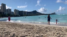 Santa - Father Christmas - walking down the beach in Waikiki Hawaii!