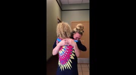 Daughter bursts into tears when mum surprises her at work after a a year apart