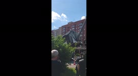 The bus with passengers crashed into a pole and hung on it with the front section
