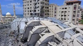 Adults and children walk amid rubble looking for personal items in devastated Gaza