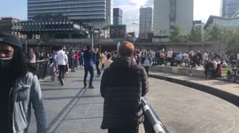 Chelsea fan walks past a group of Manchester City fans in Piccadilly Gardens, Manchester. Ahead of the Champions League Final later tonight