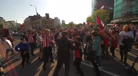 Brentford fans dance in streets outside their stadium celebrating Premier League promotion