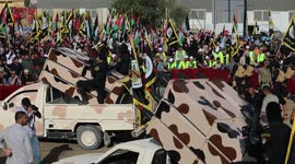 Palestinian Fighters of al-Quds Brigades, the armed wing of the Palestinian Islamic Jihad movement, parade with their weapons in the streets of Gaza City during a rally