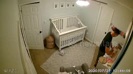 Dad changed baby then gets distracted by the diaper bin; baby rolls off of the table and requires some extreme dad reflexes to make an epic catch