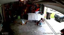 Toddler learns about safety eyes on the garage door and then takes an unbelievable ride