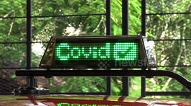 Bangkok taxis use digital displays to show whether driver has been vaccinated