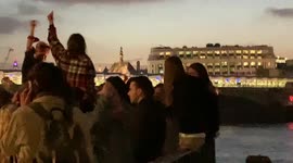 London revellers make most of warm weather to party outdoors on banks of Thames