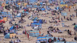 Hottest day of the year and good surfing conditions brought a large crowd of beachgoers to Fistral Bay Newquay, Cornwall