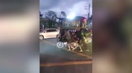 Garbage collectors let pet dogs rest on top of tuktuk while they push it after a day of work