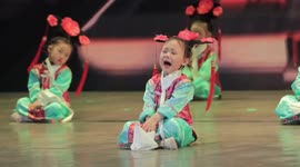 Girl performs dancing show on China's Children's Day despite bawling her eyes out