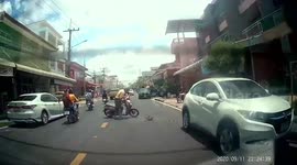 Distracted motorcycle rider playing phone crashes into back of car