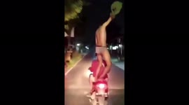 The Crazy Action of Two Youths Standing On A Highway Motorcycle While Undressing In Klaten, Central Java