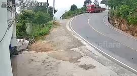 Chinese driver jumps out of window to escape after truck smashes down cliff due to brake failure