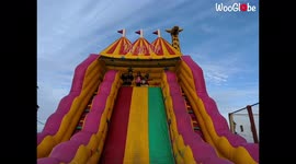 'Girl Faceplants While Sliding Down a Polished Bouncy Slide'