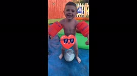 I’m sexy and I know it (toddler) dancing with armbands by his pool