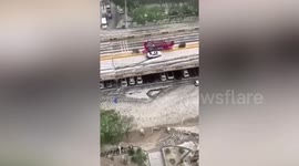 Floodwater flows down streets and hailstorm strikes northern Chinese city