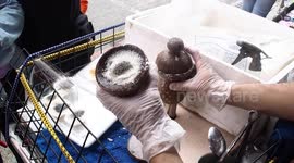 Taiwanese street vendor makes traditional sweet treat using wooden cups