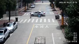 Mother and son avoid being run over after being hit by car on road in eastern China