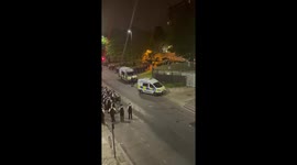 Riot police marching through Brixton in response to reported shooting
