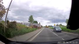 East Calder farmer drives tractor through a roundabout the wrong way towards oncoming car