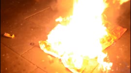 Flag burned outside London's Chinese Embassy  on Tiananmen Square Massacre anniversary