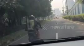 Car Drivers Chasing With Mobile Phone Snatches On Jalan Raya Kemayoran, Central Jakarta, Indonesia