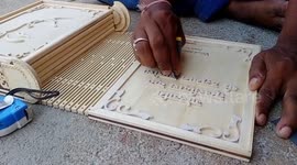 Indian artist creates wooden Hindu scripture by carving out each letter