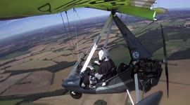 Close call as paramotor pilot dodges oncoming propeller plane in UK